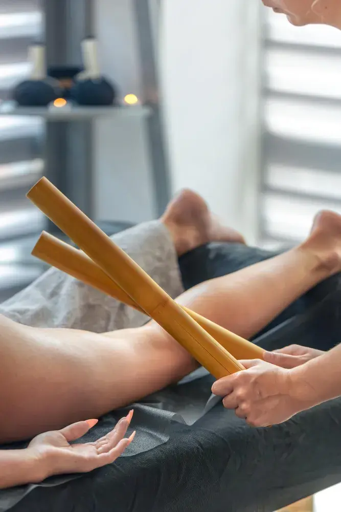 Therapist working with bamboo tools